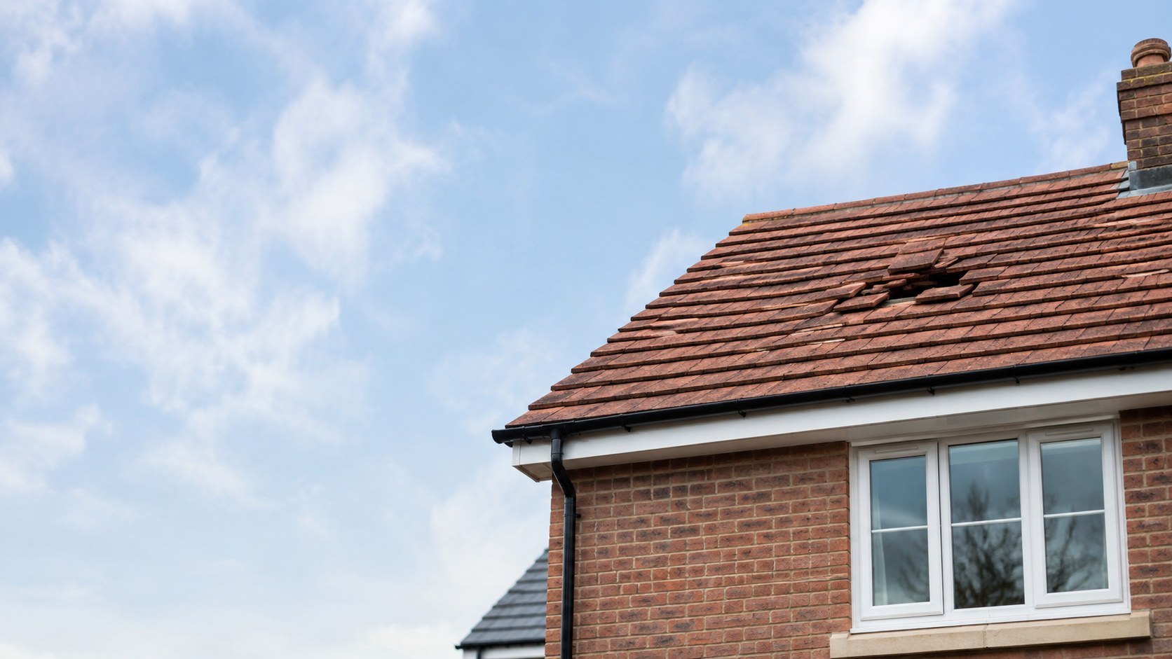 British house roof with slipped tiles